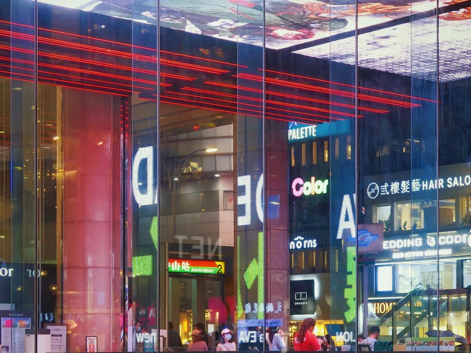 Visual Illusion from Reflections in Glass on Rainy Day at Shin Kong Department Store in Taipei